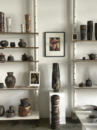 Picture frames amidst pottery